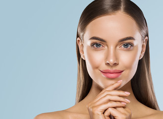 Female face clean skin beautiful woman smile tanned skin beauty blue background