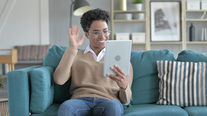 The Young African Girl Doing video Chat on Tablet