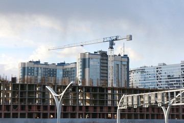 Fototapeta na wymiar Construction of a residential urban quarter by the expressway