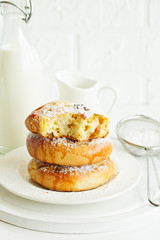 Bun with raisins and cream. Selective focus