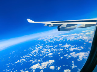 View from an airplane on a blue sky and white clouds.