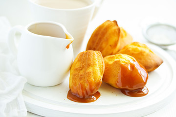 Madeleine french cookies with caramel. selective focus.