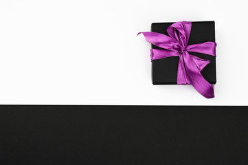 Gift wrapping by bow on a black and white background