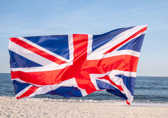 British flag on blue sky background. Flag of United kingdom.