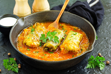 Ukrainian traditional dish with cabbage and stuffed cabbage. Selective focus.