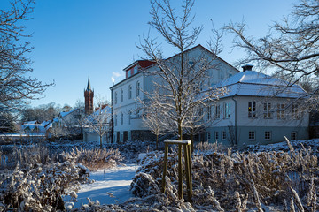 Fototapeta na wymiar View at church in the Feldberger Seenladschaft in winter