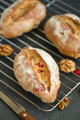 Homemade bread with nuts and dried fruits. Selective focus