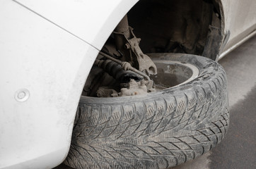  Front end of a vehicle after a car accident. Broken Car Suspension