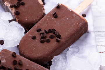 Chocolate ice cream popsicles in glaze