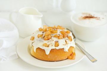 Homemade cakes, cinnamon rolls and icing.