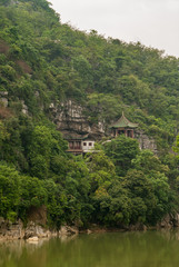 Fototapeta na wymiar Closeup of traditional buildings on slope along Xiadong, Guilin, China.