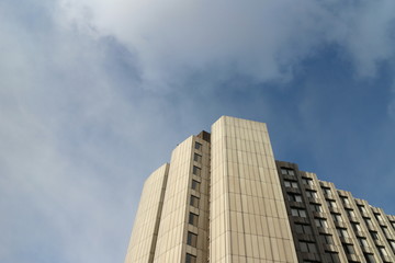 Fototapeta premium Corner of a tall building, acute angle view