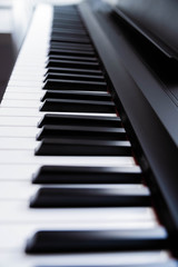 Fototapeta premium Close-up of electric piano keys, shallow depth of field. Music industry. Copy space