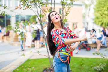 Street shaabi dance and urban dancer concept - Cheerful belly dancer dancing with arabic music on the street