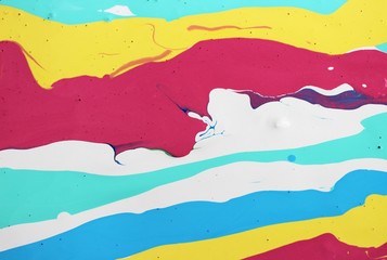 Abstract yellow-blue-red-white background. Game of colors . Acrylic texture with an interesting marble pattern. Wallpaper, mixing, modern art.