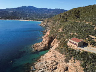 Fototapeta na wymiar Drone view of Marina di Campo gulf and coastline, Cala Ischia, Elba island, Italy