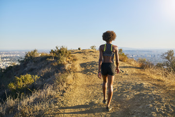 fit african american woman walking at the top of runyon canyon in los angeles