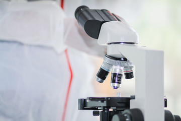 The medical team wore a coronavirus protective suit and rubber gloves to examine the coronavirus covid-19 and research for a vaccine to prevent coronavirus covid-19 to stop the epidemic