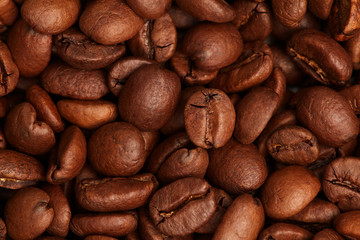 Photo of coffee beans, solid background, roasted coffee beans, texture of roasted coffee beans, high quality, close-up