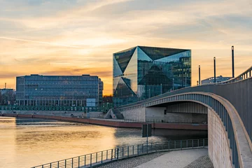 Peel and stick wall murals Berlin beautiful panoramic view at sunset, Berlin Spreebogen at Hugo-Preuss Bridge with a view of the Cube Berlin and John F. Kennedy House building at the main train station and the river Spree