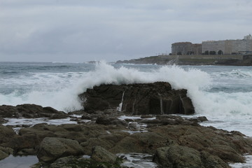 Fototapeta na wymiar Waves on a beach in A coruna city in Spain