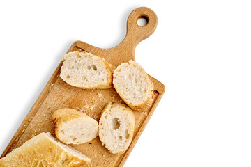 French lunch, breakfast baguette, Fresh natural French baguette, natural wooden cutting board, morning pastries from the bakery, delicate baguette, golden crust