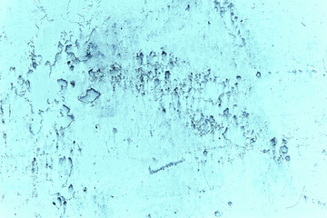 Vintage blue background. Rough painted wall of sapphire color. Imperfect plane of blue colored. Uneven old decorative toned backdrop of cyan tint. Texture of sapphirine hue. Ornamental stony surface.