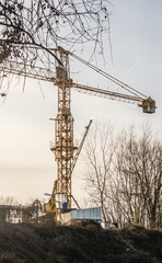 Metal crane in the yard of the factory 