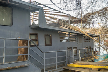 Novi Sad, Serbia - February 08. 2020: Metal boat on the bank of the Danube River 