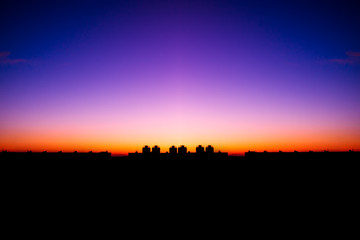 colorful sunset against the backdrop of the city landscape