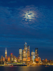 Fototapeta premium Full Moon over Manhattan Skyline view from New Jersey, USA