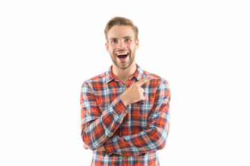 Fototapeta premium Attracting customers to buy his product. Happy guy promoting product. Man pointing finger isolated on white. Product promotion. Marketing and sales. Product advertising, copy space