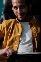 Portrait of man working on tablet