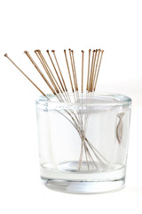 Silver needles for traditional Chinese acupuncture medicine. Isolated white background.