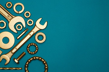 composition of golden tools on blue background