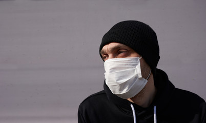 Coronavirus masked man. Covid 19. А man in a protective mask against coronavirus