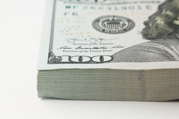 Stack of american money, one hundred dollar cash banknotes on white background, lot of one hundred dollar bills © kikinunchi