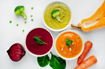 Set of vegetable soups. Soup from broccoli, spinach, green peas. Pumpkin and carrot soup. beetroot - carrot soup on a white background isolated
