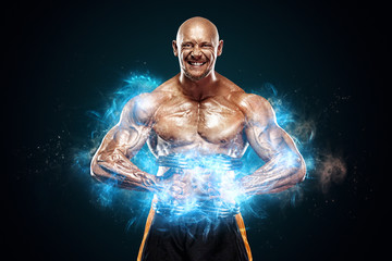 Strong and fit man bodybuilder. Sporty muscular guy with dumbbells. Sport and fitness motivation....