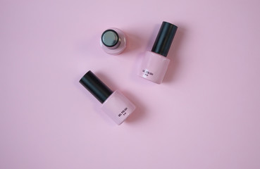 Pink nail polish on pink background
