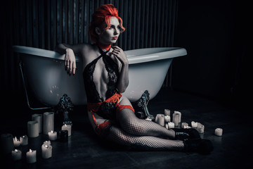 Vampire in underwear in a blood bath