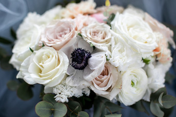 Wedding bouquet of pastel flowers, vintage style, blurred background