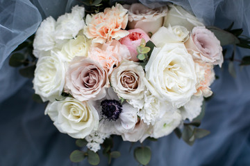 Wedding bouquet of pastel flowers, vintage style, blurred background