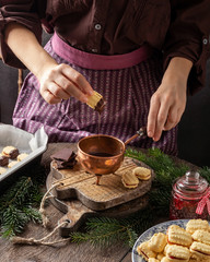 Dipping Christmas cookies in chocolate