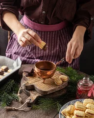 Foto op Canvas Dipping Christmas cookies in chocolate © Madeleine Steinbach