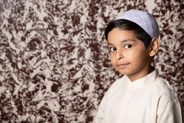 Muslim child Giving Smile toward camera with Negtive space on Left side