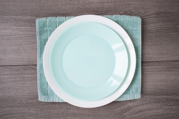 Two plates stack on wooden background