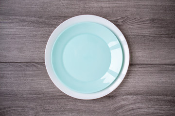 Two plates stack on wooden background