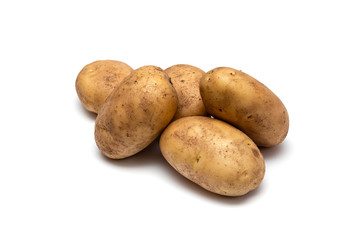 raw dirty potatoes on a white background