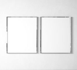 Stylish elegant Vertical metal frame mock up. Double silver frame posters on white wall and floor....